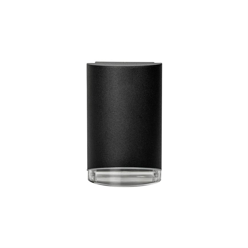 Cylinderformet sort lampe med mat overflade og klar glasbund, peger nedad og står centreret på en ensartet hvid baggrund.