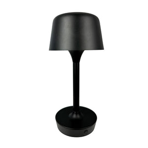 Sort bordlampe står slukket på hvid baggrund; slankt cylindrisk skaft, rund flad base med lille trykknap og klokkeformet skærm.
