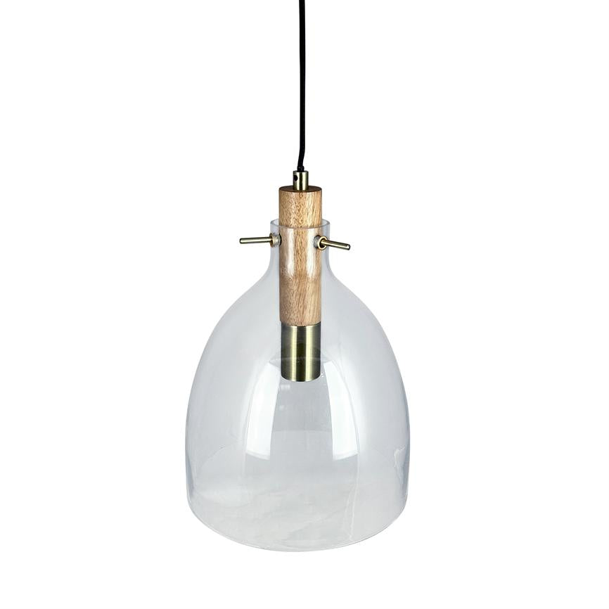 En hængende pendel-lampe med klar glaskuppel, trætop og messingdetaljer, ophængt i sort ledning foran en neutral hvid baggrund.