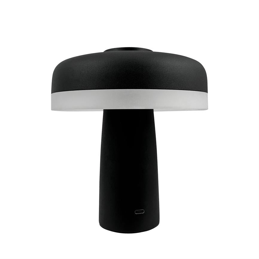 Bordlampe står med bred, rund skærm og cylindrisk fod; skærmens nederste kant er hvid, resten sort, mod en ensartet hvid baggrund.